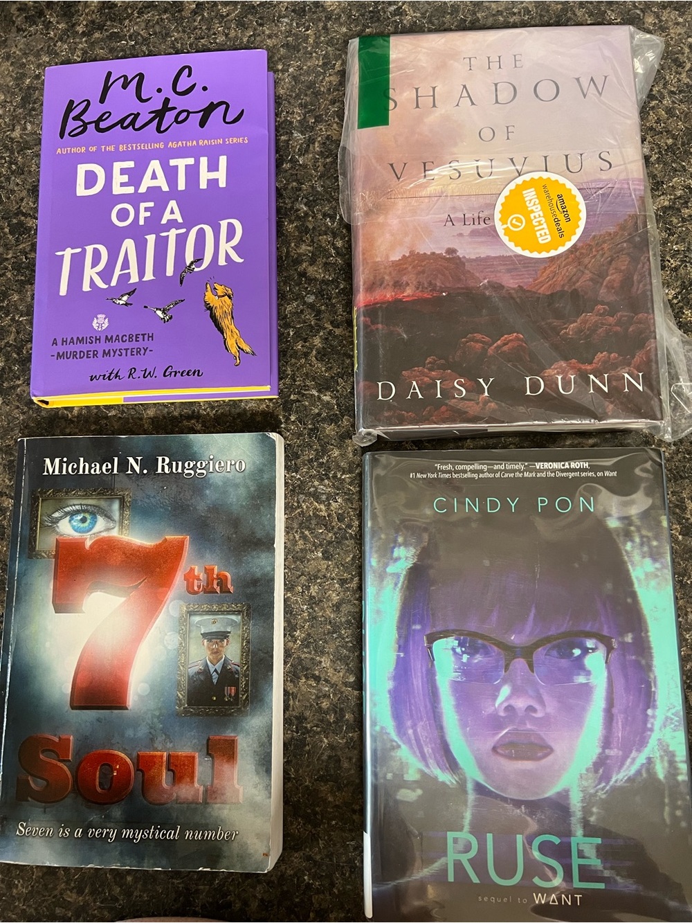 Set of Four Colorful Paperback Books - Purple, Teal, Green, Black Covers